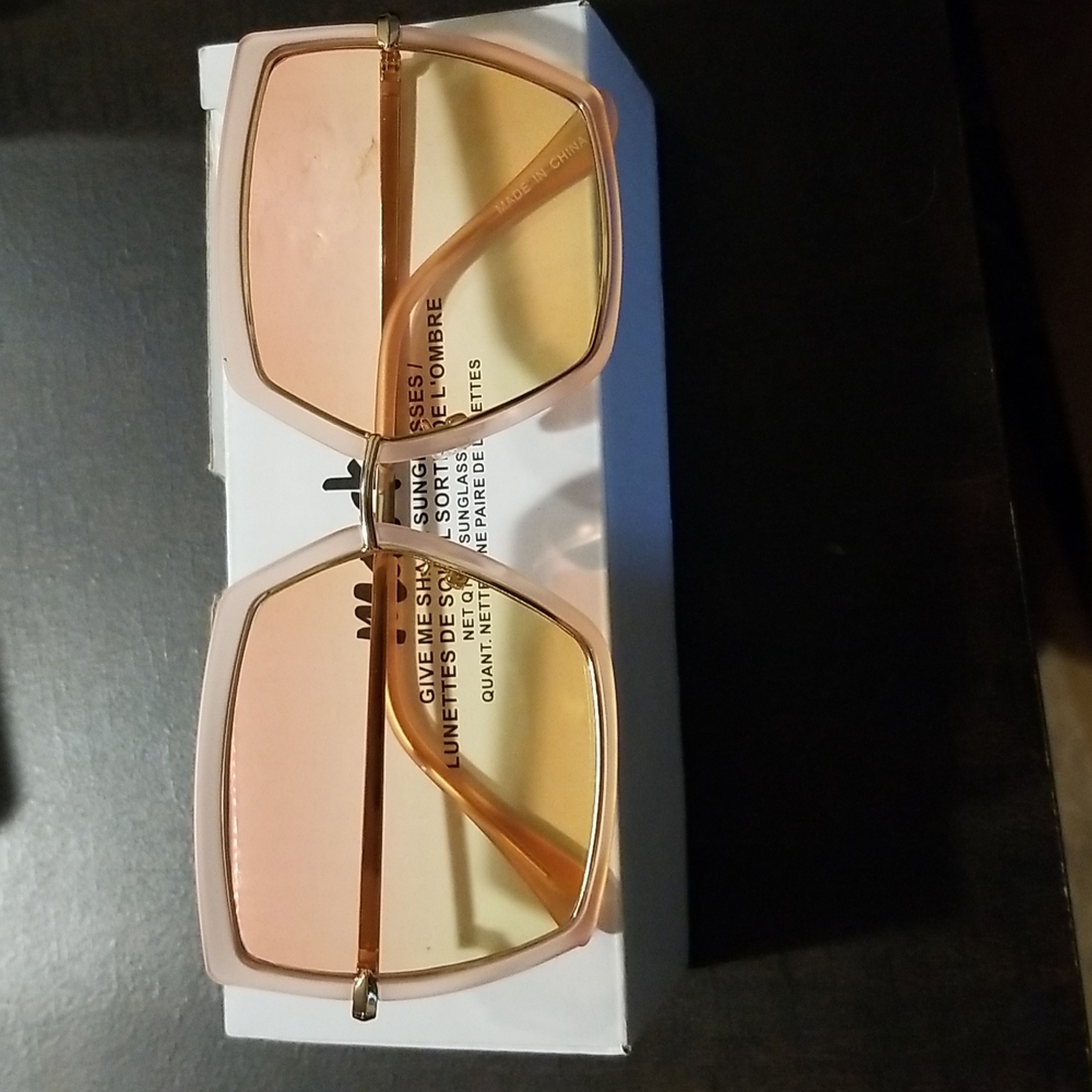 Mark Give me shade sungasses. Pink yellow ombre with gold and pink frame.